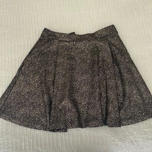 Women’s silvery gold skirt with pockets.